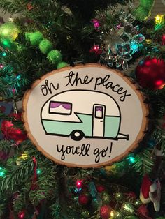 a christmas ornament that says, on the places you'll go with an rv