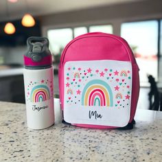 Cater for those back-to-school needs with our personalised lunch bag and matching lunch box & water bottle set!  Available in a range of designs in hot pink, blue & black. Our lunch boxes measure 18x12x6cm, they are BPA-free & the airtight seal keeps contents safe.  The water bottle is 650ml & features a flip lid with straw so your little one can drink with ease. Our lunch bags are 24x19.5x10cm & feature an 'easy to hold' handle making them perfect for smaller children.  Please note that the lunchbox is only available in pink & blue, so if you are ordering a black set, a blue lunch box will be sent. Check out our other listings for matching products! Hello and welcome to Mia Makes!  We are a small gifting business offering a vast range of thoughtful & personalised gifts for all the special White Lunch Box For Back To School, Gifting Business, Boys Lunch Bags, Girls Lunch, Personalized Lunch Bags, Personalized Pencil Case, Box Water, Best Lunch Bags, Lunch Cooler