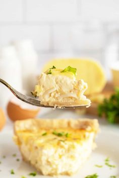 a piece of quiche being held by a fork