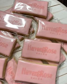 some pink candy bars wrapped in plastic on a white plate with the words havebrose printed on them