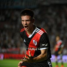 a soccer player is excited about his team's win over the other team in their match