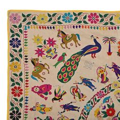 an embroidered cloth with colorful designs on it