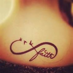 the word faith written in cursive writing on a woman's lower back