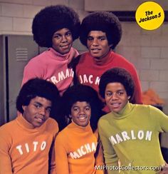 the jacksons posing for a photo in their matching sweaters