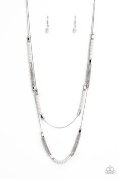 Featuring a layered display, two elongated silver snake chains dance down the neckline. Sections of shiny silver flower beads, capped by high sheen silver accents, are interspersed with stacks of white and silver studded beads, creating a bubbly, fanciful finish in rich neutral shades. Features an adjustable clasp closure.

 Sold as one individual necklace. Includes one pair of matching earrings. Bling Necklace, Neutral Shades, Silver Snake Chain, Flower Beads, White Necklace, Paparazzi Jewelry, Silver Accents, Shiny Silver, Silver Flowers