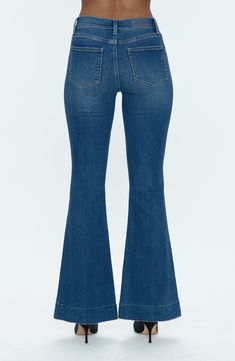 An on-trend high rise balances the flared legs of these retro-inspired jeans cut from premium low-stretch denim in a just-right wash. 32 1/2" inseam; 24" leg opening; 11" front rise; 13 1/2" back rise (size 29) Zip fly with button closure Five-pocket style 75% cotton, 13% rayon, 10% polyester, 2% polyurethane Machine wash, tumble dry Imported Mid-rise Medium Wash Flare Jeans, Trendy Medium Wash Flares For Fall, Trendy Medium Wash Fall Flares, Trendy Fall Flares In Medium Wash, Chic Denim Flares For Spring, Spring Flared Hem Jeans With Frayed Edge, Fitted Wide Leg Denim Blue Flares, Medium Wash Flares For Spring, Flare Cropped Jeans In Medium Wash For Fall