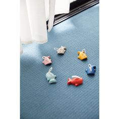 small plastic animals are sitting on the floor