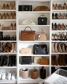 a closet filled with lots of different types of shoes and purses next to each other