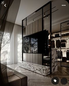 the room is decorated in black and white marble, with an open closet behind it