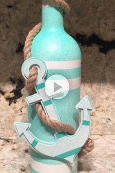 a bottle with an anchor and rope on it