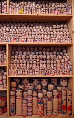 several shelves filled with lots of different kinds of jars and containers on top of each other