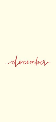 the word december written in red ink on a beige background