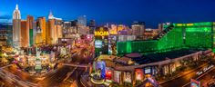 an aerial view of the las vegas strip at night with traffic and skyscrapers in the background