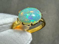 OPAL   𝐑𝐢𝐧𝐠 925 sterling silver  𝐑𝐢𝐧𝐠 𝐅𝐨𝐫  Women 𝙀𝙓𝙋𝙀𝙉𝙎𝙄𝙑𝙀 & 𝙇𝙀𝙂𝙀𝙉𝘿 𝙍𝙄𝙉𝙂   ˜"*o*.˜"*o* WITH  LEGENDARY  OPAL *o*"˜.*o*"˜ Material  925 Sterling Silver  . Gemstone OPAL Gemstone  Shape OVAL . Cut Type  Excellent . Birthstone  OCTOBER . Ring Type  Statement  . Style  Art Deco . Ring For  WOMEN Handmade Round Opal Ring, Handmade Round Opal Ring For Formal Events, Luxury Opal Ring Oval Cabochon For Gift, Luxury Multi-stone Opal Ring Gift, Gold Opal Ring As Gift, Oval Cabochon, Luxury Multi-stone Opal Ring Collectible, Luxury Polished Opal Ring, Oval Cabochon, Fire Opal Ring, Silver Rings Handmade