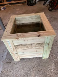 a wooden box is sitting on the ground