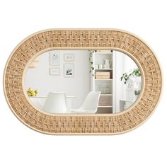 a mirror that is made out of wood and has a white chair in front of it