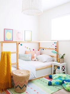 a child's bedroom decorated in pastel colors