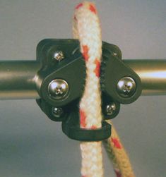 a close up of a rope with two metal hooks attached to it