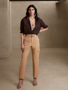 Utility with a twist, this cargo pant is crafted using a luxurious and softly structured fabric, enhanced with advanced stretch for a refined look and feel.  SLIM FIT: High waisted, slim through hip and thigh, tapered leg.  Ankle length.  Zip fly with hook and bar closure.  Removable belt.  Front, back and side cargo pockets.  Pleated detail at the cuff.  Unlined.  SLIM FIT: High waisted, slim through hip and thigh, tapered leg.  Ankle length.  Ankle length.  Inseams: Petite/Short 24", Regular 2 Cargo Pants Outfit, Pantalon Cargo, Cargo Pant, Style Mistakes, Slim Pants, Business Casual Outfits, Looks Style, Bottom Clothes, Look Chic