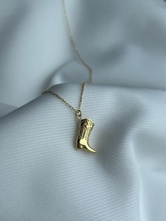 Kick up your style with our Cowboy Boot Necklace! 🤠 Get this cute jewelry made with the quality of high quality elements✨ You can go with 925K Sterling Silver with the options of Gold, Rose Gold or White Gold finish Beautiful jewelry for everyone 🤍 Details * 925K Sterling Silver → 14K Gold, Rose Gold or White Gold plated * Chain length is approximately 18 inches (16+2 in extender) / 45 cm (40+5 cm extender) * Time is important! You will receive your package as soon as possible 🚚 * We care about the quality of metal to make sure it will last for a long time * We use enamel technique to color the jewelry and high quality zircons only * There can be tiny differences on each item. Color changes and shade differences of the stones and enamel is possible since each jewelry piece is unique and Cowboy Boots Necklace, Cowboy Boot Necklace, Cowboy Necklace, Boot Jewelry, Summer Gift, Handcrafted Necklace, Cow Boy, Jewelry Lookbook, Girly Jewelry