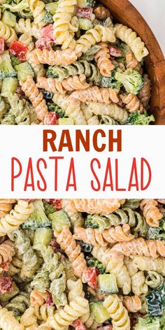 pasta salad with broccoli and tomatoes in a large wooden bowl on top of a white table