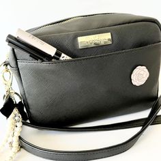 Black saffiano faux leather crossbody purse with one outer front snap pocket and one inner pocket. Features gold hardware and includes two straps so you can choose how to style! Featured in the 2023 August "Belle Ame" Anniversary Luxe VBKit. This listing is for the Crossbody Purse only + 2 straps (1 gold chain, 1 adjustable faux leather) - additional supplies & accessories are not included. 2nd photo taken by Keisha | @drinkcoffee.makestuff3rd-4th photos taken by Laura | @lala_planslife5th photo Elegant Black Coin Purse With Card Slots, Black Travel Coin Purse With Key Clip, Black Wallet On Chain Crossbody, Black Crossbody Wallet With Gold-tone Hardware, Luxury Crossbody Wallet On Chain With Gold-tone Hardware, Black Crossbody Purse, Purse Black, Leather Crossbody Purse, Crossbody Purse