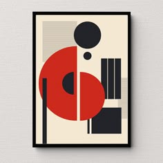 a red and black abstract art piece hanging on a wall