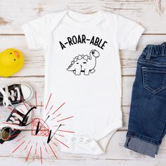 A-Roar-Able Dinosaur Baby Onesie - Funny Baby Onesie - Cute Baby Gift Baby Onsie Decorating Idea, Dinosaur Onesie, Newborn Onesie Cricut Ideas, Funny Onesies For Boys, Cricut Onesie, Cute Onesies For Babies, Funny Onsie Ideas, Baby Cricut Ideas, Baby Shirt Ideas