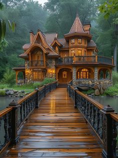 a wooden bridge leading to a large house in the middle of a forest with lots of trees