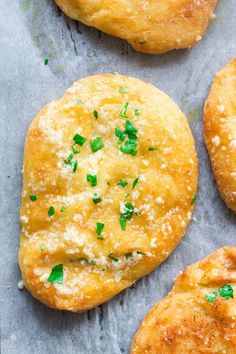 some breaded pastries with parsley on top