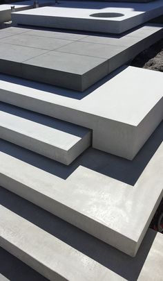 some concrete blocks are stacked on top of each other in order to be used for landscaping