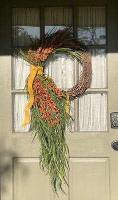 a wreath is hanging on the front door