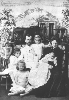 an old black and white photo of a family