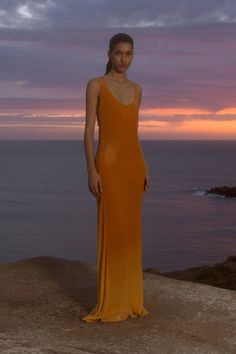 A delicate mid-rise maxi skirt, designed from luxurious silk crepe in Terracotta Ombré. Sitting at the hips, it is a floor-grazing, soft silhouette with a bias cut that falls in line with the body. Style with the Biarritz Top for summer evening wear. Formal Beach Wedding Guest Dress, Mediterranean Clothing Style, Sunset Theme Outfit, Sunset Outfits, Terracotta Dress, Summer Evening Wear, Colombian Style, Sunset Fashion, Goddess Maxi Dress