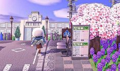 an animal crossing the street in front of a bus stop with purple flowers on it