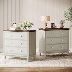 two white dressers sitting next to each other on top of a carpeted floor