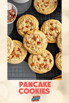 there are many cookies that are on the cooling rack and in front of them is an advertisement for pancake cookies