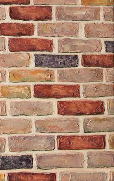 an old brick wall with different colored bricks