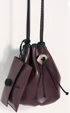 Handcrafted in Italy, this genuine leather bucket bag features a drawstring closure with a crystal embellishment and an attached envelope style wallet. -Woven trim -Shoulder strap -Rounded design Measurements: Length: 8 in Circumference: 9.86 in Collection Ideas, Trendy Shoulder Bag, Bag Details, Mini Bucket Bags, Drawstring Bucket Bag, Mini Bucket, Leather Handbags Women, Crocodile Leather, Leather Bucket Bag