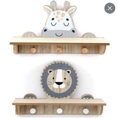 two wooden shelves with animals on them and one has a giraffe head above the shelf