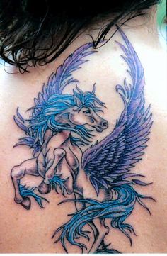 the back of a woman's neck with a horse and wings tattoo on it