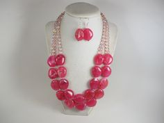 "Contains small parts! Not for children! Choking Hazard!Chunky fuchsia pink statement necklace,multi strand statement pink necklace, beaded necklace, big magenta beads, pink statement jewelry,matching earrings, BEST SELLER Spring 2022 Fashion A bold and dramatic statement necklace featuring oval acrylic  fuchsia  beads. 3 strands, light weight. Silver plated  lobster clasp Measurements: short strand 18\" (458cm) plus 3 1/2\" extender Each piece of jewelry from my shop comes beautifully packaged Spring 2022 Fashion, Jewelry Matching, Pink Statement Necklace, Necklace Big, Janet Guzman, Pink Dark, Pink Necklace, 2022 Fashion, Necklace Beaded