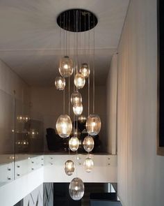 a modern chandelier hanging from the ceiling