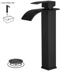 a black faucet sink and toilet paper dispenser