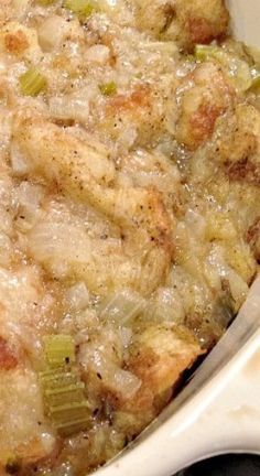 a casserole dish with meat and vegetables in it, ready to be eaten