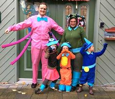 three adults and two children dressed in costumes