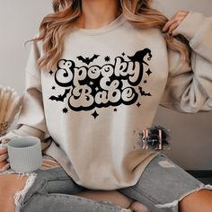 ✨This super cute Crew neck sweater would make the perfect sweater to collection!  ✨My Sweaters also make an amazing gift idea! If you are looking for a birthday gift, housewarming gift, mothers day gift, christmas gift, a gift for family, a gift for friend or a appreciation gift for teachers! ✨I use Gildan 50/50 blend crew neck sweaters, these sweaters are a super soft and comfy cotton/polyester blend. ✨Each image is pressed into shirt using a commercial grade heat press. ✨Washer and dryer safe Spooky Oversized Halloween Sweatshirt, Oversized Spooky Halloween Sweatshirt, Spooky Halloween Crew Neck Sweater, Fun Oversized Sweatshirt For Fall, Oversized White Halloween Sweater, Oversized Fun Sweatshirt For Fall, Trendy Halloween Long Sleeve Sweatshirt, Trendy Long Sleeve Halloween Sweatshirt, Cute Halloween Sweatshirt With Letter Print