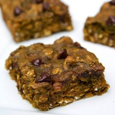 four chocolate chip cookie bars on a white plate