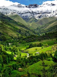 an image of a valley with mountains in the background