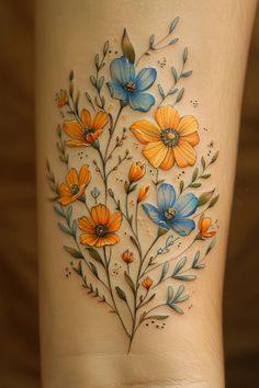 a woman's leg with flowers painted on it